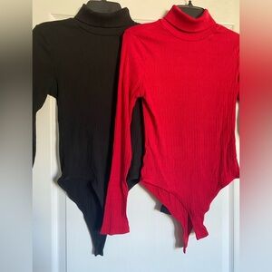 Two turtle neck body suits.